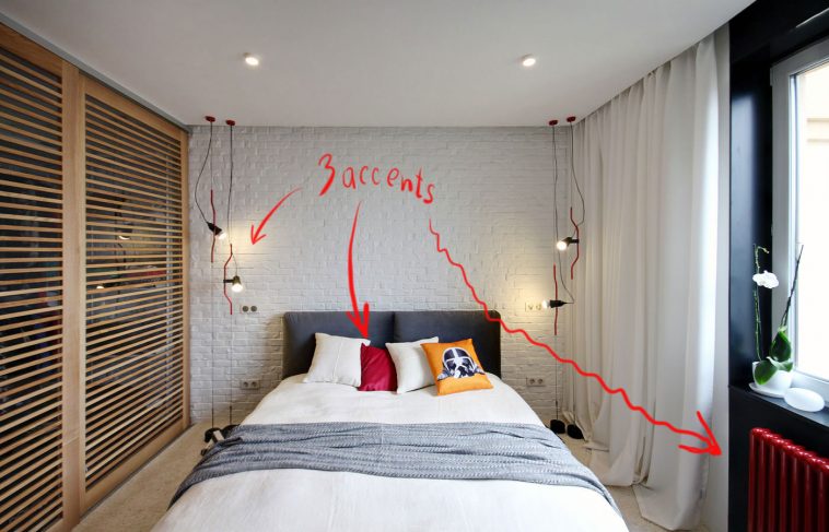 #red accents in small white bedroom